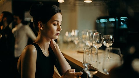 Woman Leaning on Table