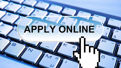 Computer keyboard with 'APPLY ONLINE' button.
