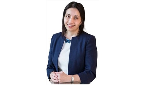 Dr. Mumtaz Patel wearing a blue blazer and white top