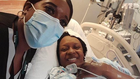 Tomasek with her doula, Keosha McLamb, at a hospital after giving birth to Ezekiel.