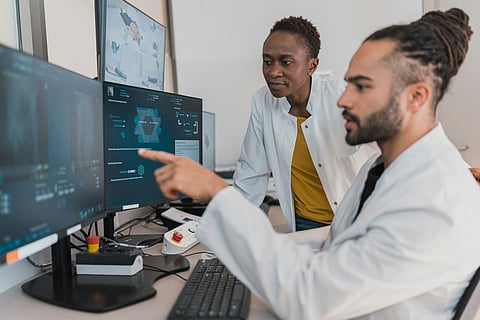 Medical professional examining a screen with machine learning tools designed to diagnosis of nonmelanoma skin cancer.