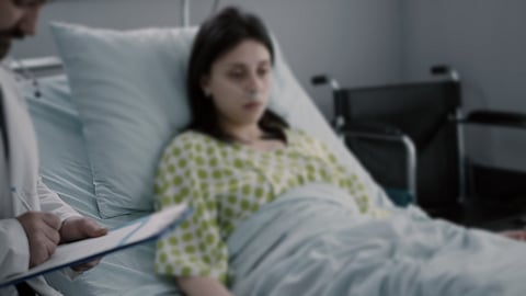 Specialist physician writing medical expertise on the clipboard