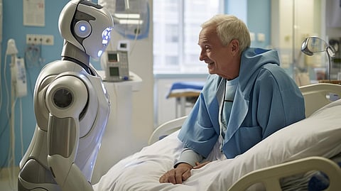 Robert sitting near a patient in a hospital room