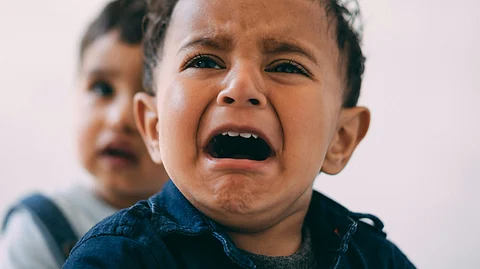 A child seems upset in the picture.