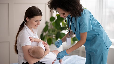 Little baby being at the health clinic for vaccination