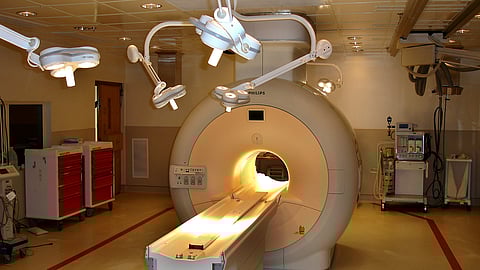 A medical imaging room with a large MRI machine.