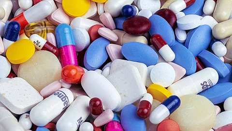 Large assortment of various pills and capsules in different shapes and colors.