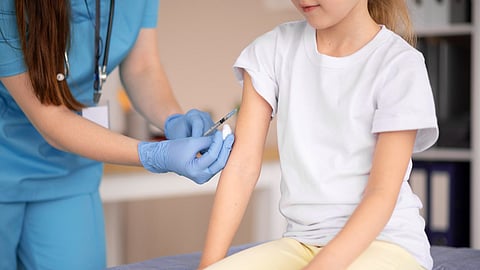 Little girl having her blood draw out at the hospital