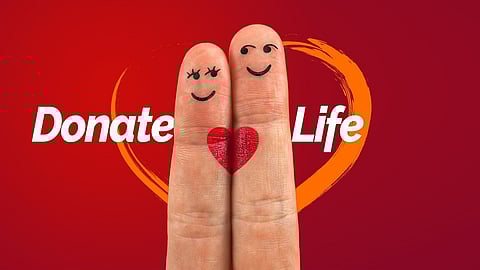 Two finger giving a message of saving life by donating.