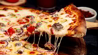 Various regional American pizzas show different crusts, toppings, and cuts.