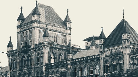 A large building featuring a prominent clock tower at its peak, showcasing classic architectural design of Bombay HC.