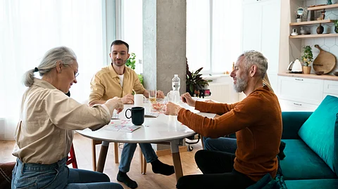 A group of people sitting around a table.