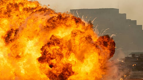 A large explosion erupts in the sky, creating a dramatic burst of fire and smoke.