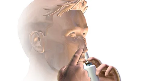 Depiction of a person using nasal spray.