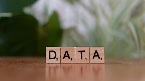 Data block on wooden table, symbolizing fears of veteran DNA research going to waste.