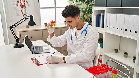 The image shows a doctor diagnosing patients samples.