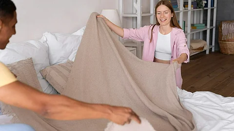 Close up on people making home comfortable