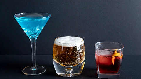 Various alcohol containing drinks presented in different tumblers.