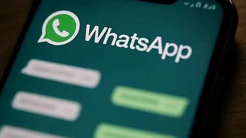 A mobile screen showing a blurred WhatsApp chat.