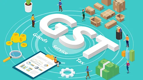 GST (Goods and Services Tax) illustrated on a blue surface, surrounded by people, boxes, and gold coins - symbolizing its impact on businesses and everyday lives.