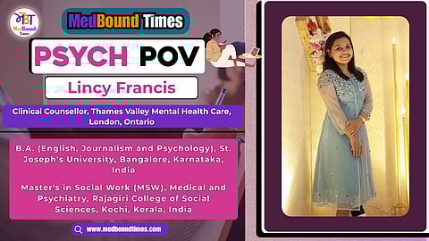 A picture of Lincy standing in well-lit up stage and posing in a sky-blue dress.