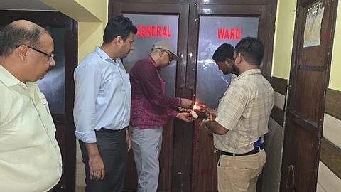 Officials sealing the general ward of Goldar Hospital in Lakhimpur Kheri after the newborn death case sparked outrage over alleged medical negligence.