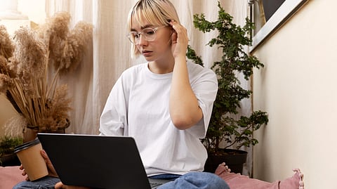 A woman taking an online Psychiatry lesson from her home.