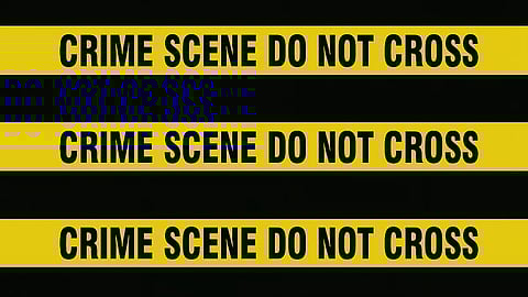 An image in black and yellow stripes, saying crime scene do no cross.
