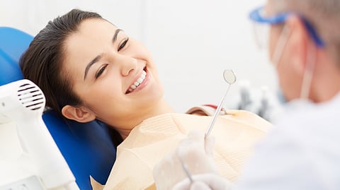 Illustration of a smiling person showing teeth with orthodontic issues.