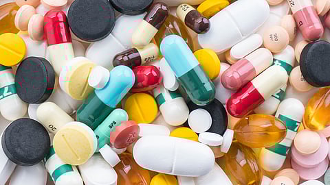 Image of different forms of tablets and capsules in multiple colors.