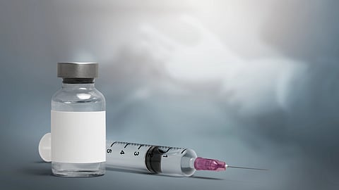 Image showing steroids in ampule and an injection.