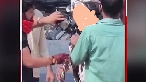 A screenshot of the video of the black ink assault on the doctor.