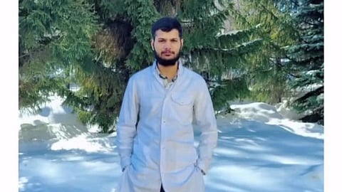 An image of Ajit Singh Chaudhary in white apron outdoors.