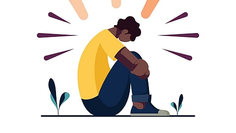 Illustration of a man sitting in a sad posture.