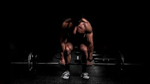 https://unsplash.com/photos/topless-man-in-black-shorts-sitting-on-black-and-silver-barbell-9dzWZQWZMdE