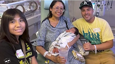 Image showing the Lopez family with the newborn.