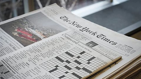 Image of a New York Times newspaper showing a crossword puzzle.