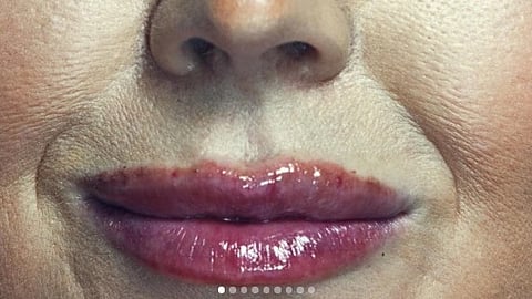 A close-up photo of lips of Karoline Leavitt.