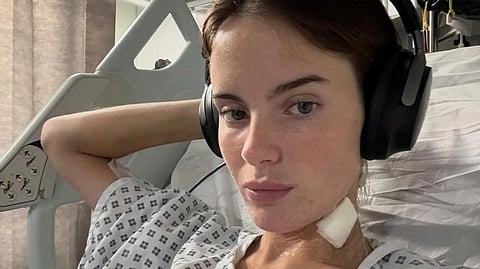 An image of Faye in a hospital gown.