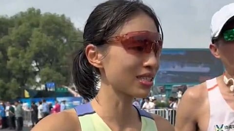 An image of Zhang Shuihua at a marathon event.