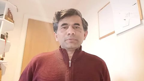 Image of Dr. Sangram Patil in a red sweater.