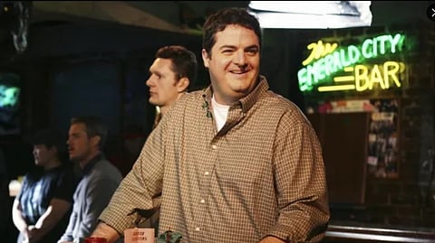 Steven W. Bailey standing in a bar.