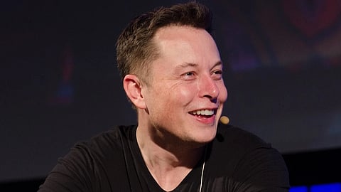 Elon musk in a black Tshirt.
