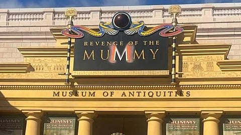 Revenge of the Mummy antique museum entrance with the board reading the same.