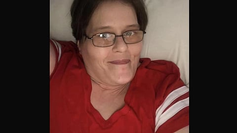 Selfie of Charity Pierce in a red shirt.