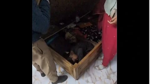 Screengrab of the video circulating online showing the girl being rescued from under the bed storage.
