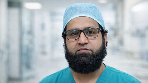 Dr. Sohail Anjum wearing scrubs