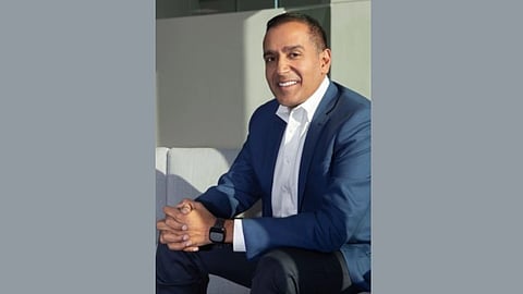 Portrait of Dr. Sachin H. Jain in a blue formal suit and a white shirt smiling while looking towards the camera.