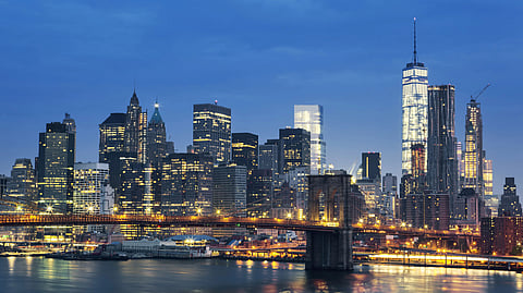 New York City, Manhattan Midtown at dusk with the Brooklyn Bridge, USA.