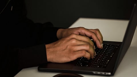 A man working no a laptop.